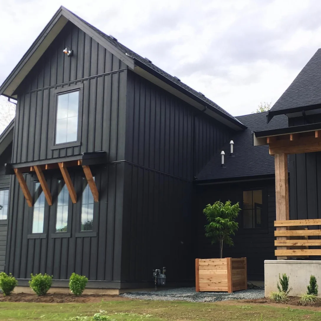 Hardi Board N Batten A black house with James Hardie siding installation in Powder Springs, GA